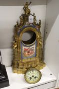A 19th century ormolu mantle clock with Sevres style panels.