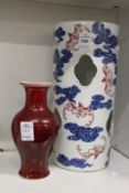 A Chinese Sang-de-Boeuf vase and a hat stand.