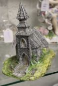 A Beswick model of a church.
