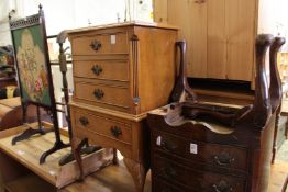 Two small chests, a fire screen and a towel rail.