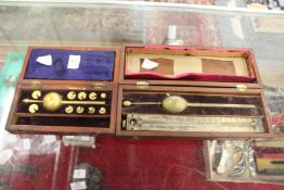 A Sikes hydrometer and a similar item.