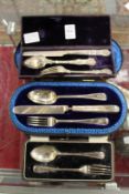 Three cased silver christening sets.