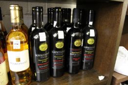 Twelve bottles of Greek sweet red wine.