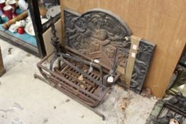 A cast iron fireback, fire dogs and grate.