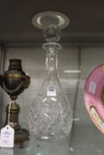 A cut glass decanter.