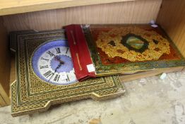 An Islamic leather blotter and a similar wall clock.