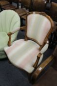 A French style beech framed open armchair.