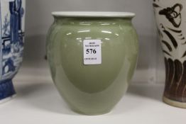 A Chinese Celadon coloured porcelain vase.