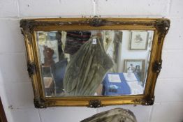A gilt framed mirror.