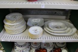 A quantity of Spode Queen's Bird china to include numerous plates and serving dishes.