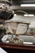 A Georgian silver and cut glass pedestal sugar basket.