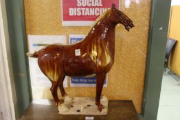 A large Tang style pottery horse.