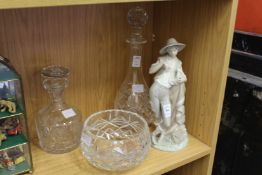 A Lladro figure of a young shepherd, two glass decanters and a glass bowl.