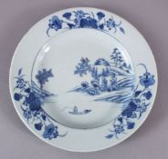 AN 18TH CENTURY CHINESE YONGZHENG PERIOD BLUE AND WHITE PLATE, painted with a landscape, native