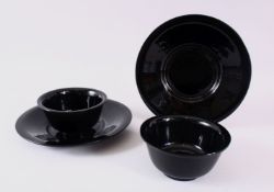 TWO CHINESE BLACK PEKING GLASS BOWL & PLATES, the bowls 11cm, the plates, 20cm. (4)