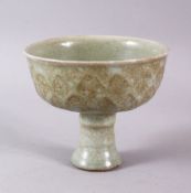 A CHINESE CELADON CRACKLE GLAZED PORCELAIN STEM DISH, the body with lappet style moulded