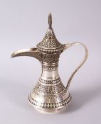 AN ISLAMIC OTTOMAN SILVER SILVER DALLAH COFFEE POT, decorated with motif decoration and a hinged