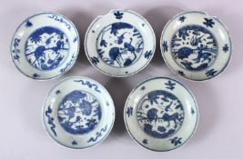 A SET OF 5 CHINESE BLUE & WHITE PORCELAIN SAUCER DISHES, with blue central decoration depicting