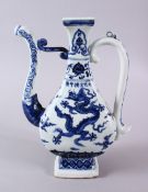 A CHINESE MING STYLE BLUE & WHITE PORCELAIN DRAGON EWER - decorated with dragons and clouds to the