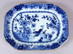 AN 18TH CENTURY CHINESE BLUE & WHITE PORCELAIN SERVING DISH, decorated with peacocks in landscape