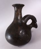 A GOOD EARLY AMLASH RYTON 1000BC POTTERY RAMS HEAD VASE, with a moulded base with a rams head