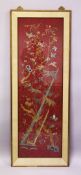A LARGE CHINESE EMBROIDERED PANEL, depicting butterflies and birds amongst bamboo and native
