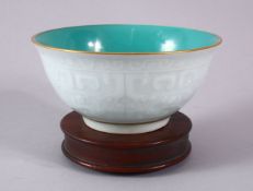 A CHINESE CARVED DRAGON CELADON & TURQUOISE RICE BOWL - The interior with a turquoise glaze, the