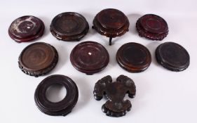 A MIXED LOT OF 10 CHINESE CARVED HARDWOOD STANDS - each of varying size, style and timber, the