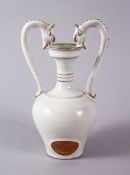A RARE CHINESE DING STYLE TWIN DRAGON HEAD HANDLE JAR - the body with and oval unglazed panel of