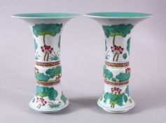 A PAIR OF CHINESE DOUCAI DECORATED FLARED RIM PORCELAIN VASES, each decorated with sprays of lotus