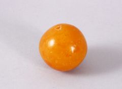 A GOOD & LARGE EGG YOLK AMBER CARVED BEAD, 4CM , 30GMS.
