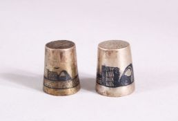 TWO 19TH CENTURY IRAQ SILVER & NIELLO INLAID THIMBLES, each with inlaid landscape views,