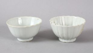 A SMALL PAIR OF CHINESE MONOCHROME WHITE PORCELAIN PETAL MOULDED BOWLS, each with a ribbed body in