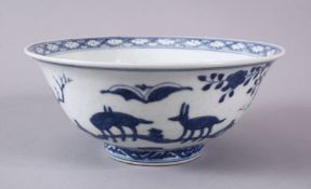 A CHINESE MING BLUE & WHITE PORCELAIN BOWL, decorated with landscape scenes with animals, the base