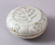 A CHINESE SONG STYLE FLORAL CYLIDRICAL BOX & COVER, with moulded floral decoration, 8cm diameter.