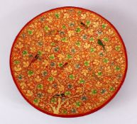 A FINE 19TH CENTURY INDIAN KASHMIRI LACQUERED PAPIER-MACHE DISH, painted with birds amongst native
