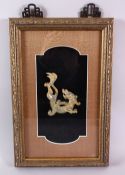 A GOOD CHINESE FRAMED CARVED JADE FIGURE OF A CHILONG, the archaic formed chilong within a box