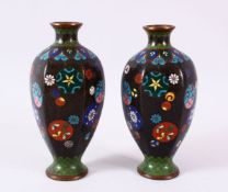 A PAIR OF CHINESE CLOISONNE BLACK GROUND VASES - each with a black ground and roundel decoration