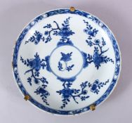 A CHINESE BLUE & WHITE PORCELAIN DISH - decorated with native floral sprays around a central