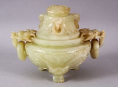 A CHINESE CARVED JADE TRIPD LIDDED CENSER, carved with lion dog handles and rings, stood upon