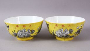 A PAIR OF CHINESE YELLOW GROUND PORCELAIN BOWLS, decorated with floral decoration and birds, the