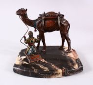 A GOOD TURKISH SPELTER FIGURE OF A CAMEL AND ATTENDANT, the attendant in prayer aside his camel,