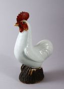A CHINESE PORCELAIN FIGURE OF A COCKEREL, with carved feather decoration with a pale celadon