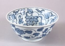 A 20TH CENTURY JAPANESE BLUE AND WHITE BOWL, with floral decoration, 15cm diameter.