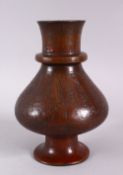 A 19TH CENTURY ISLAMIC PERSIAN BRONZE CALLIGRAPHIC VASE, the body with roundel motif decoration with