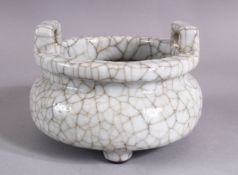 A CHINESE CRACKLE GLAZED PORCELAIN CENSER, the body with wire style decoration twin handles, 14cm