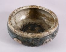 A 17TH CENTURY DAMASCUS GLAZED POTTERY BOWL, dated 1058 Hijri / 1649ad, with panels of calligraphy