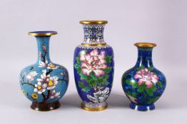 A MIXED LOT OF THREE CHINESE CLOISONNE VASES, each with a varying shade of blue grounds, each