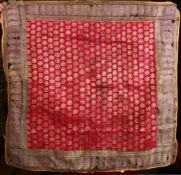 A 17TH CENTURY PERISAN SILK TEXTILE PANEL, with a red / pink ground with gold motif, approx 75cm
