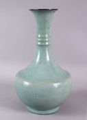 A CHINESE RU STYLE LONG NEC PORCELAIN VASE, with a ribbed neck, base with incised and gilded